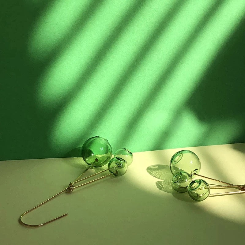green ball earrings